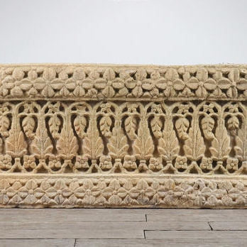 Decorative carved ancient yellow sandstone panel